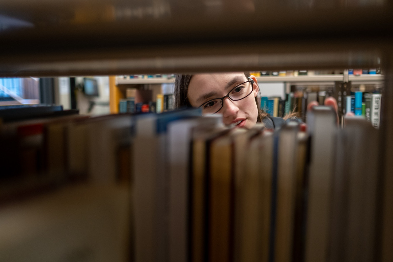 Student look for books in the Library