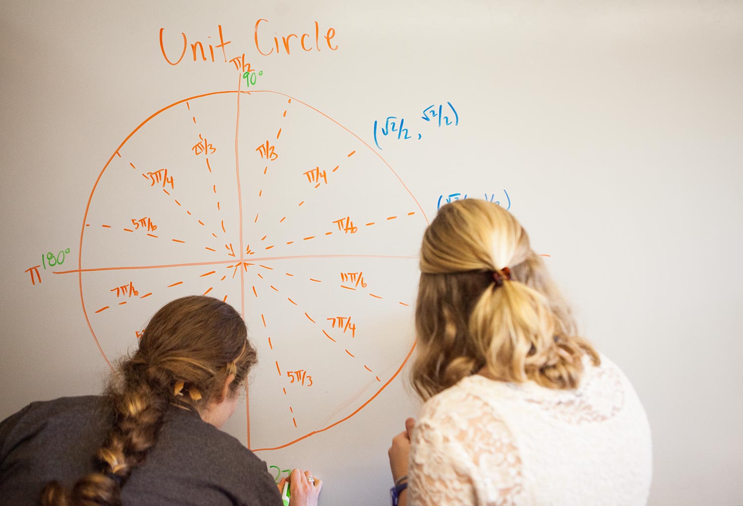 Students working on a whiteboard