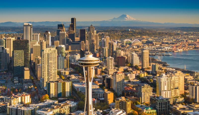 An image of the Seattle skyline that includes the Space Needle and Mount Rainier in the distance