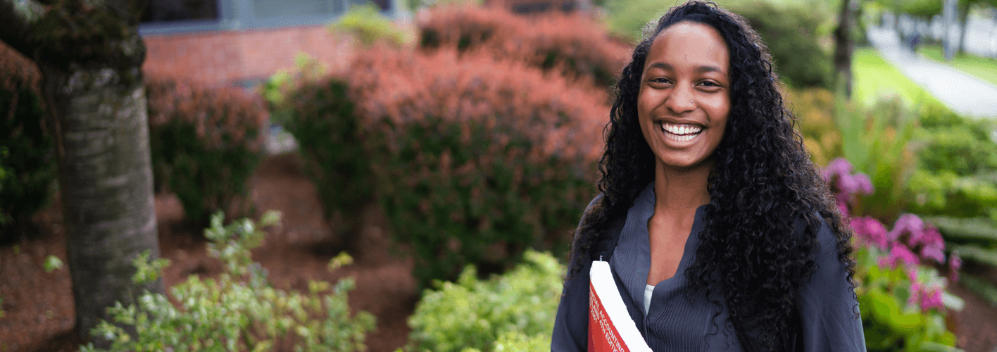 Business student in front of McKenna Hall