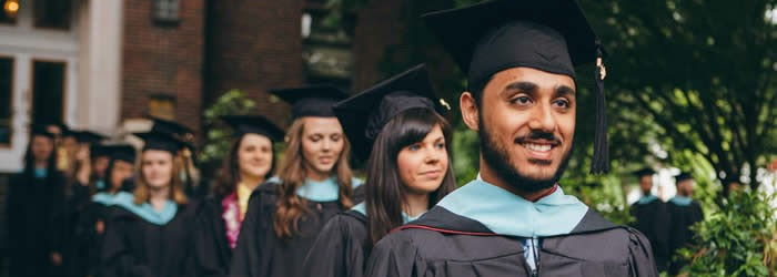 Graduating students in cap and gown