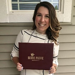 Julia Dorn poses with her diploma