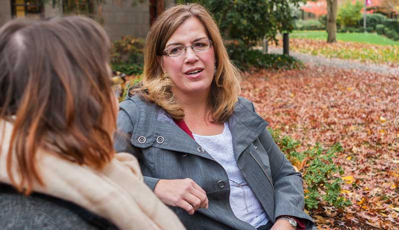 Professor talking with a student