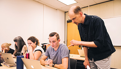 Thane Erickson interacting with one of the students in his classroom