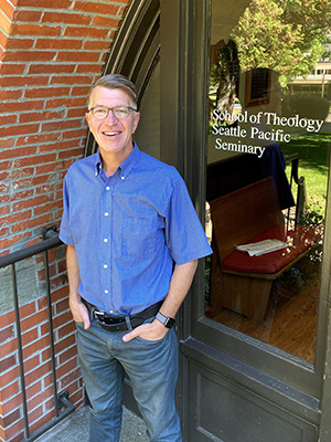 Doug Strong stands in front of the School of Theology