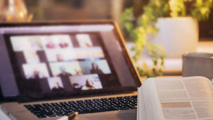 macbook and bible on desk