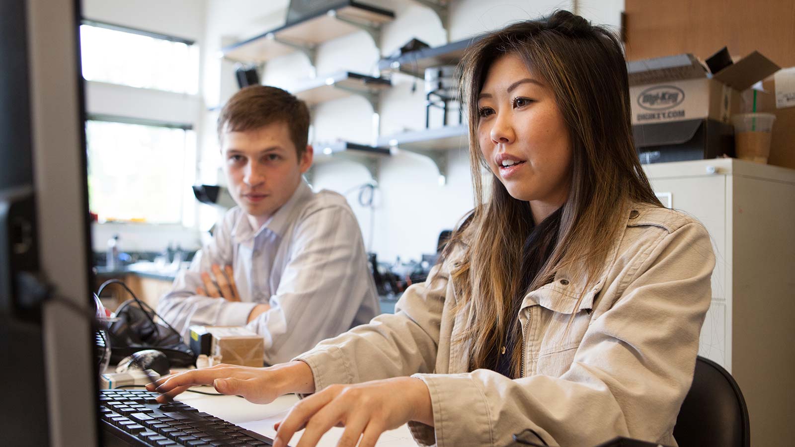 Students working in front of a computer