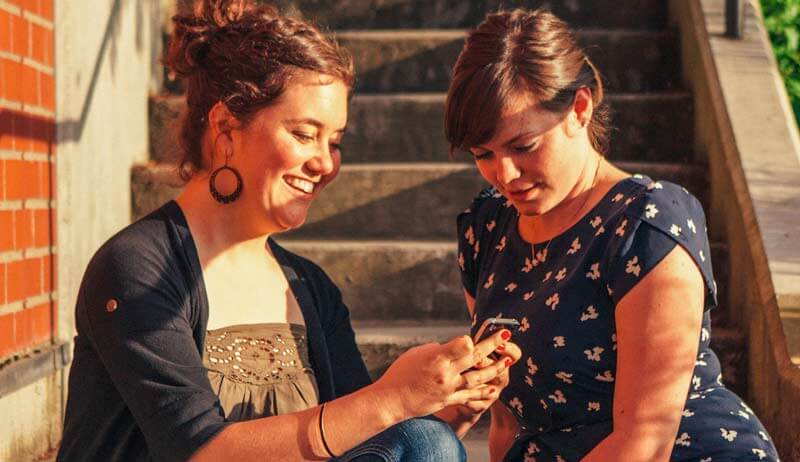 Students browsing on their phones