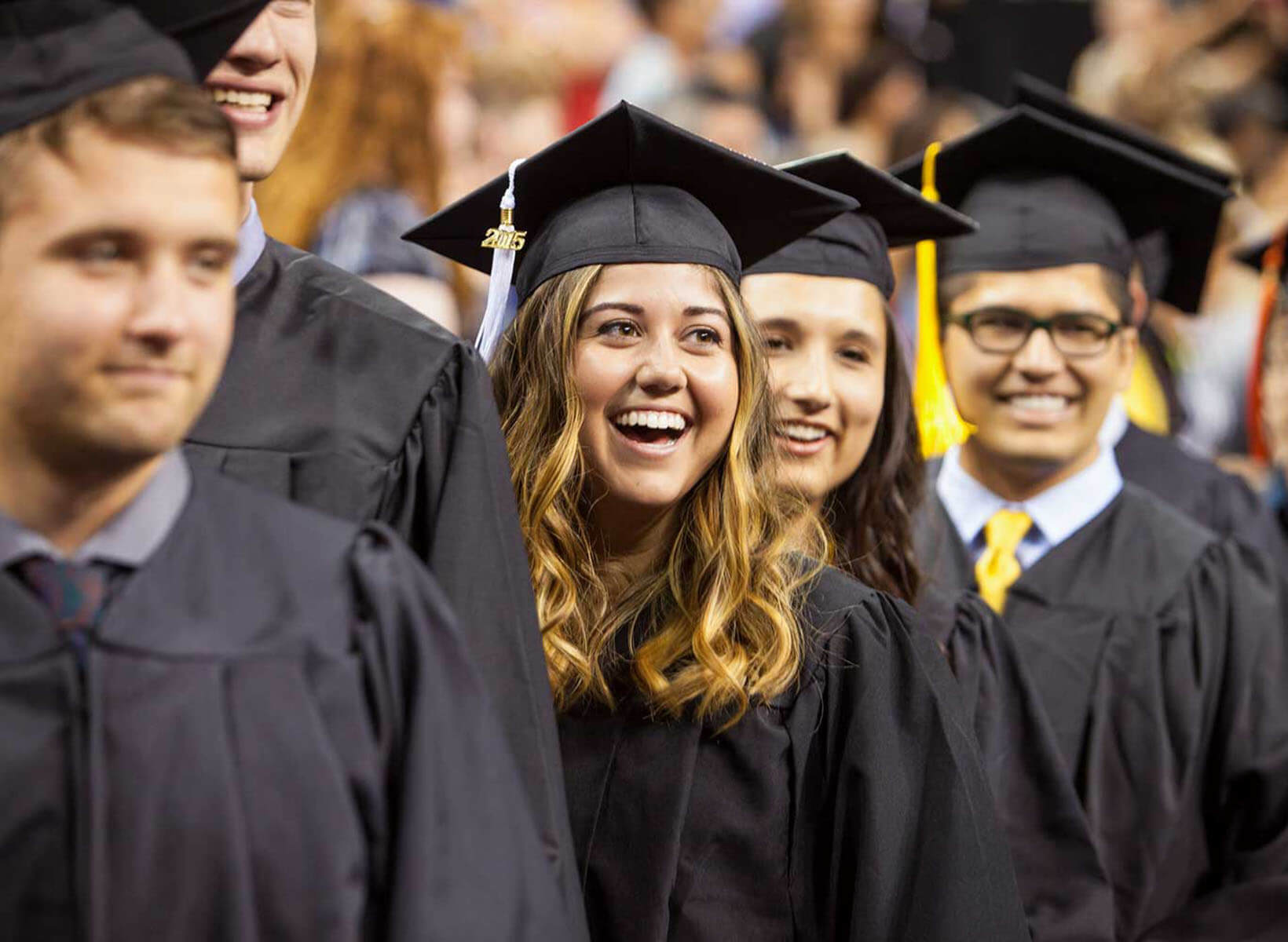 SPU undergraduate students in their caps and gowns during Commencement