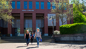 Three students walking in front of SPU