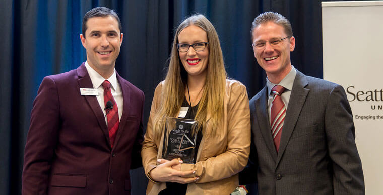 Moorea Seal McDaniel receiving her Gold Alumni of the Year award