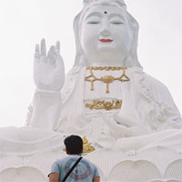 Keelan Long, walking up the steps to the Guan Yin, the Buddhist Goddess of Mercy