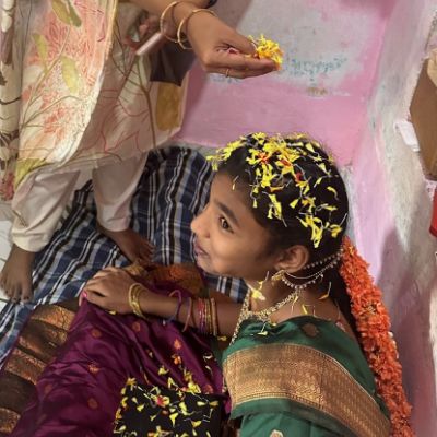 Young Girl Rajahmundry. Grandmother being honored at a Mother's Day banquet in Rajahmundry, India. 