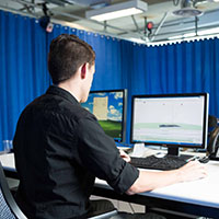 An SPU Student works at a computer