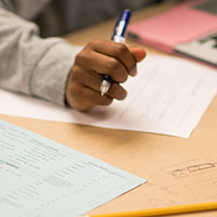 An SPU student works at a desk