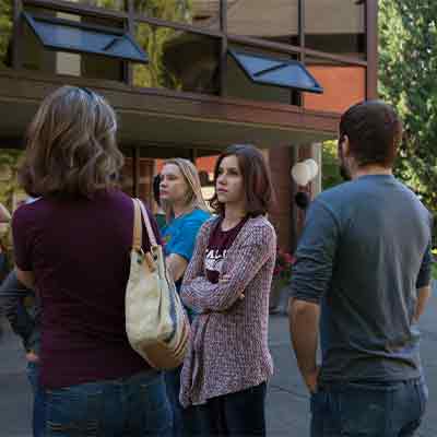 Incoming students and their parents interacting on move-in day at Seattle Pacific University.