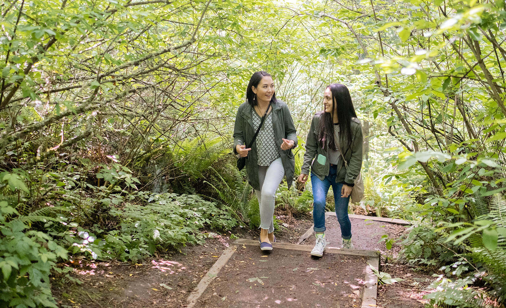 Two SPU students walking through the forest | photo by Chris Yang