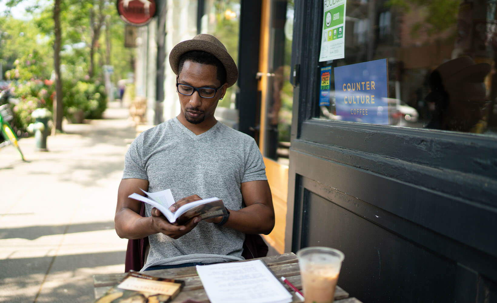 SPU student Chris Fuller studies outside a Ballard coffee shop - photo by Chris Yang