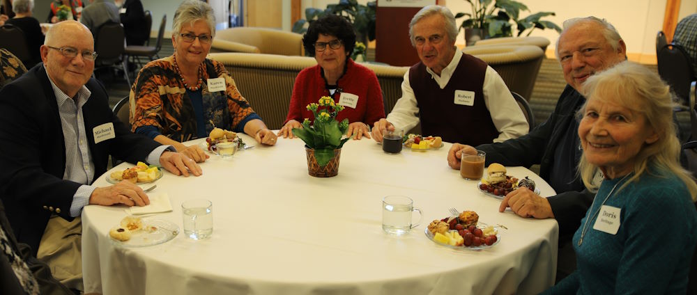 Emeriti faculty sitting around a table